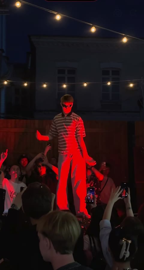 Lead dancer and crowd in an early moment of the Cheba Man reference