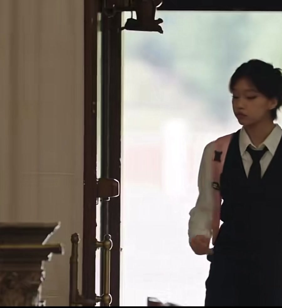 The main character entering through the church doorway