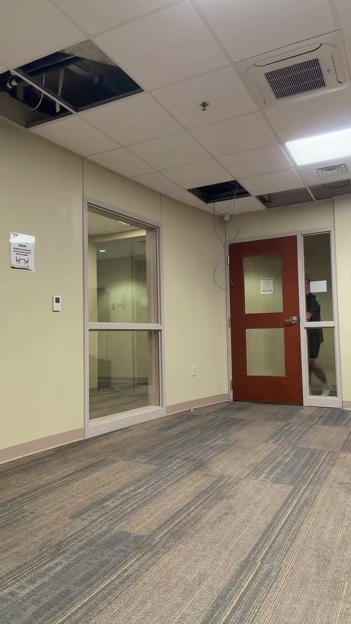 Original four-person hallway relay with high-knee hops and dancers moving past the fixed vertical camera