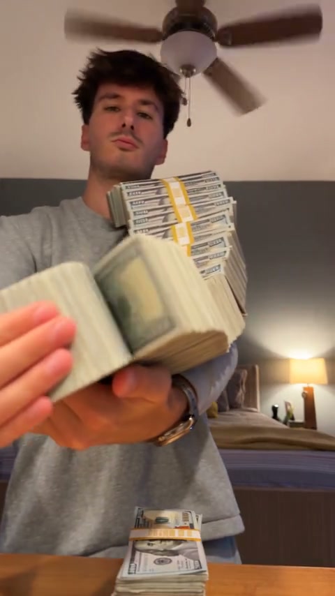 Money Spread AI community example with a grey-sweater character displaying cash stacks and opening a money fan