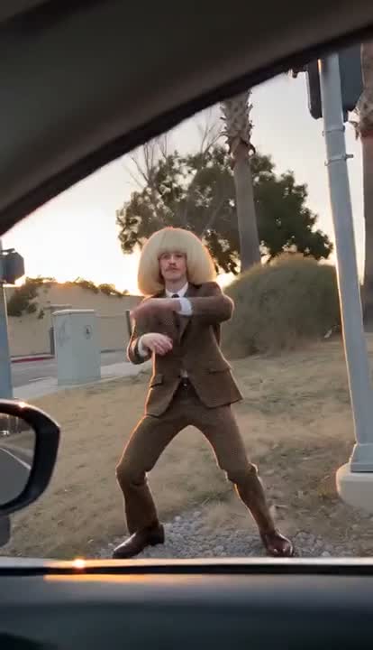 Plug Walk AI reference with a brown-suited dancer taking cash through a car window and stepping back to dance