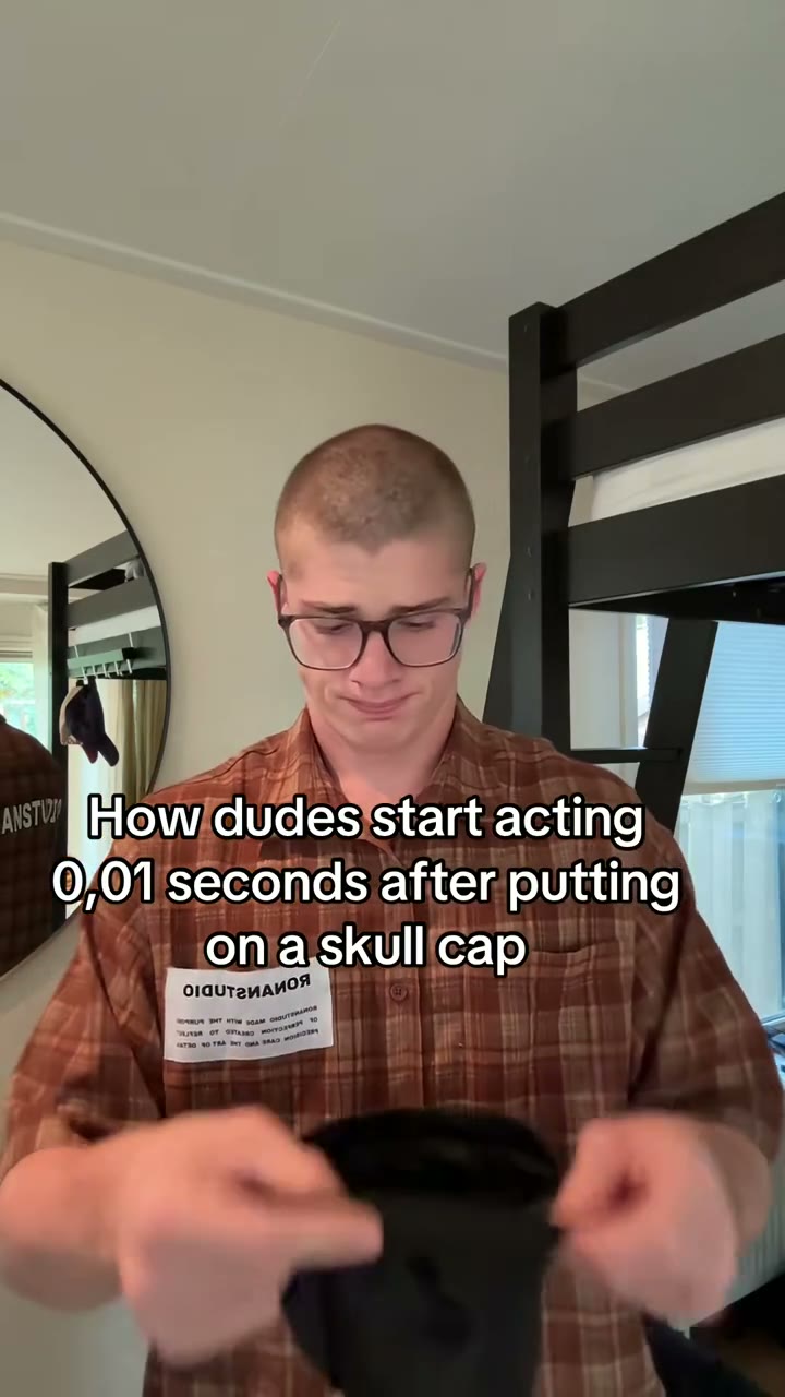 The cap gesture before the darker scene