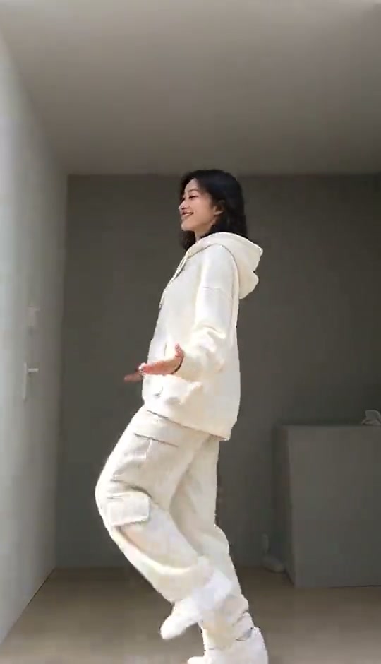 A frame from the reference showing the dancer turning with both shoes visible
