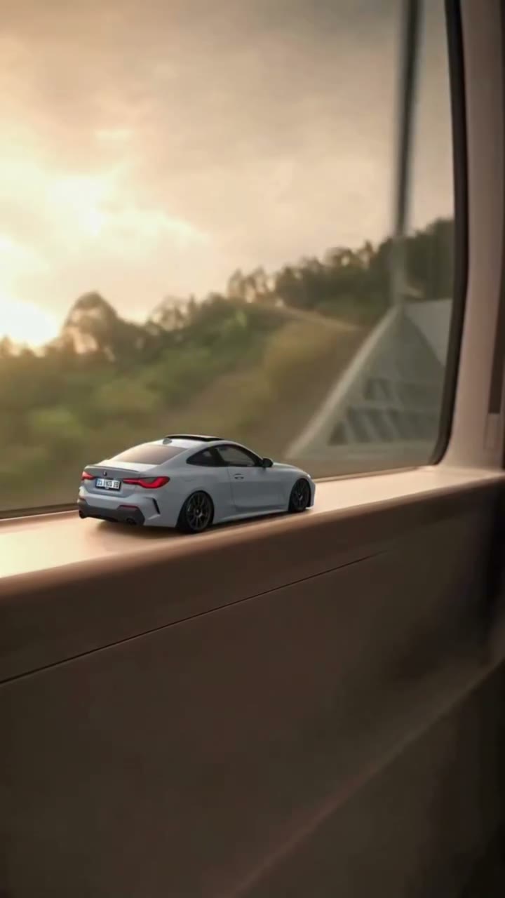 A miniature white car on a train windowsill becomes a full-size car on a night road