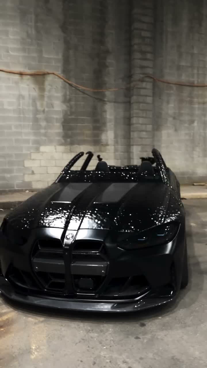 Black liquid forms a car in a dim garage before close and wide vehicle views